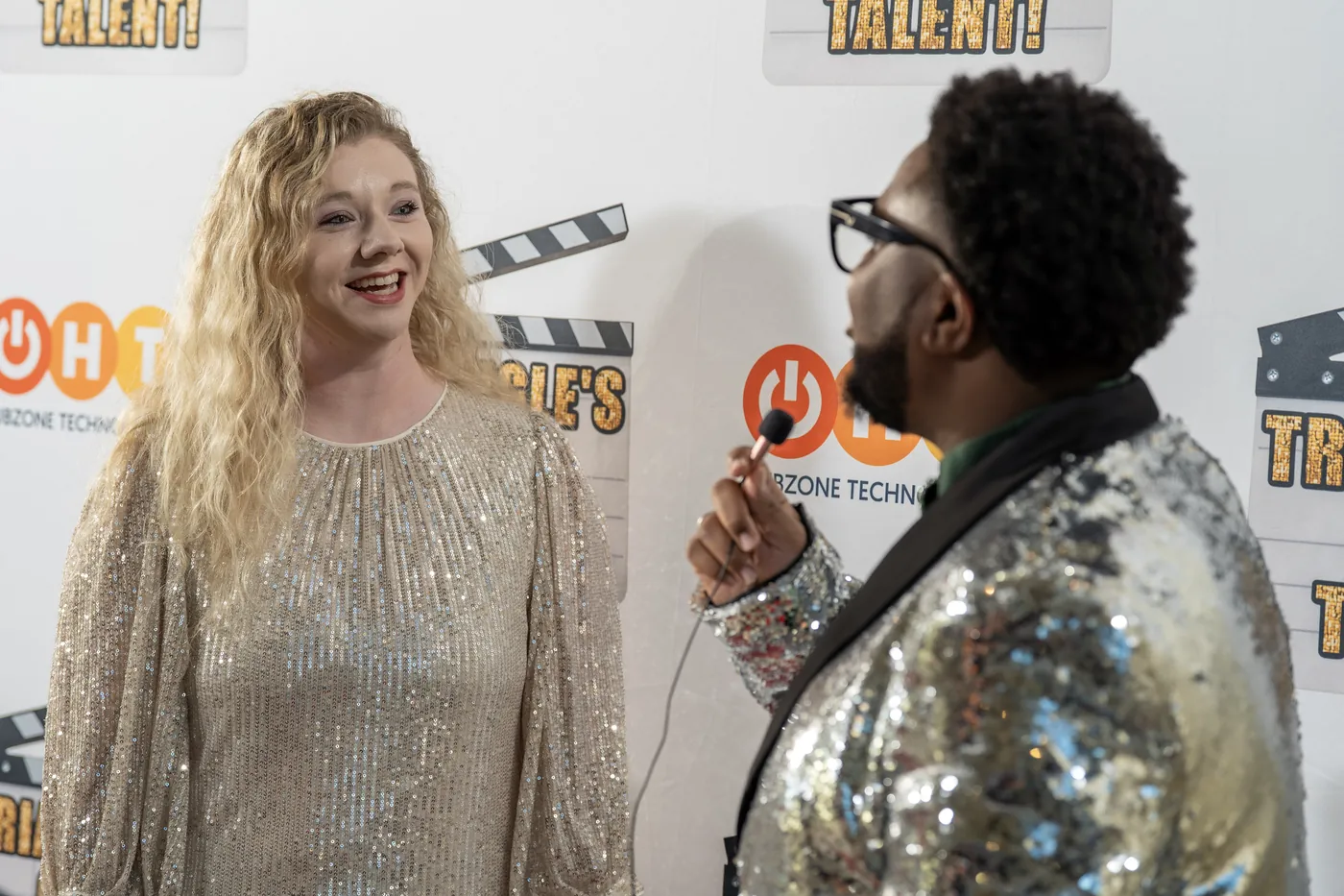 A contestant during a pre-show interview in front of the Triangle's Got Talent backdrop.