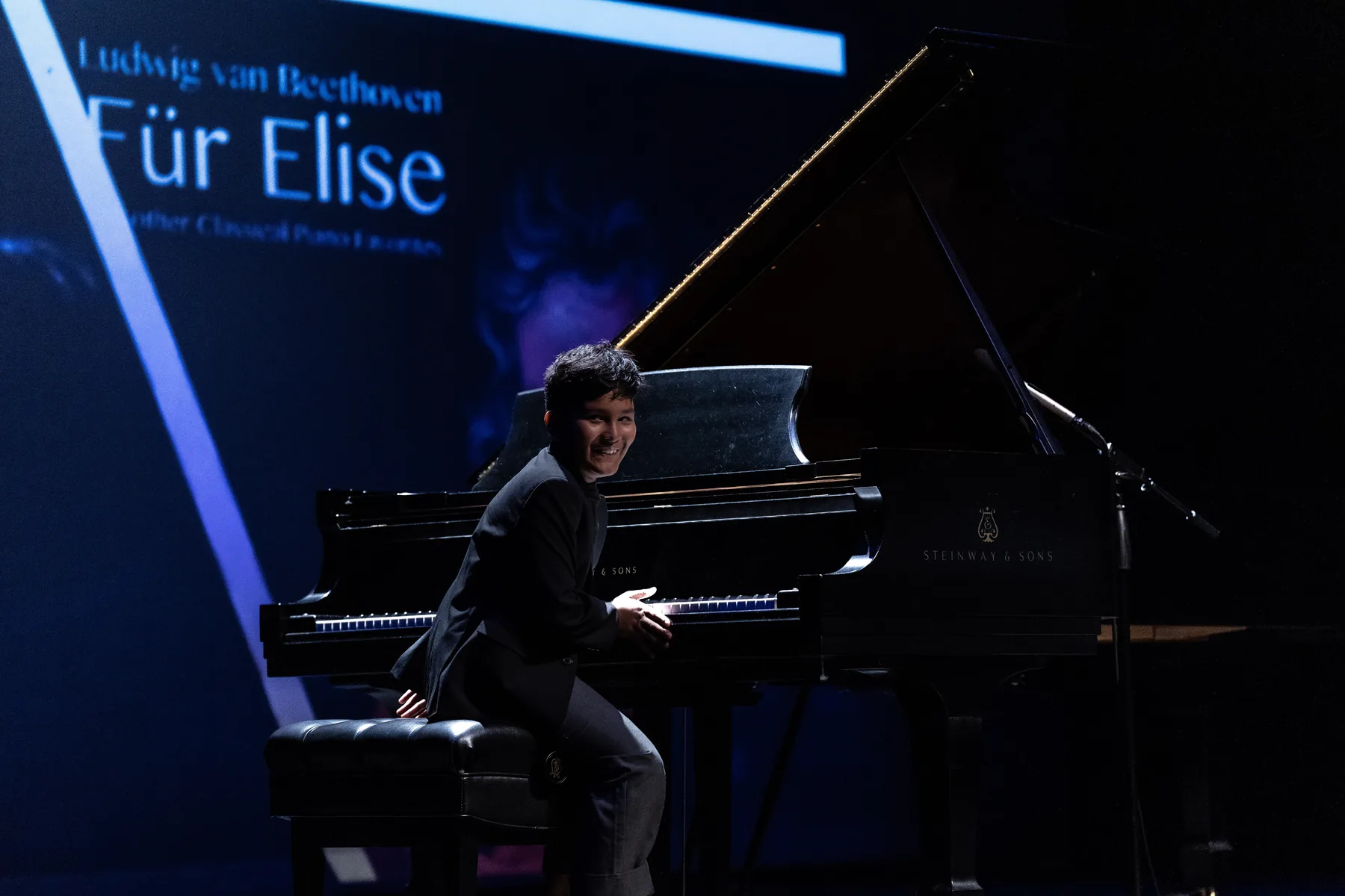 Samridh Bhattacharya seated at the piano during Triangle's Got Talent.